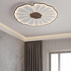 The Clérachic ceiling light in dark walnut finish glows warm in a room with a marble accent wall and curtains.