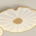 Clérachic ceiling light macro shot showing the light wood-grain rim and centre with fanning ribbed acrylic.