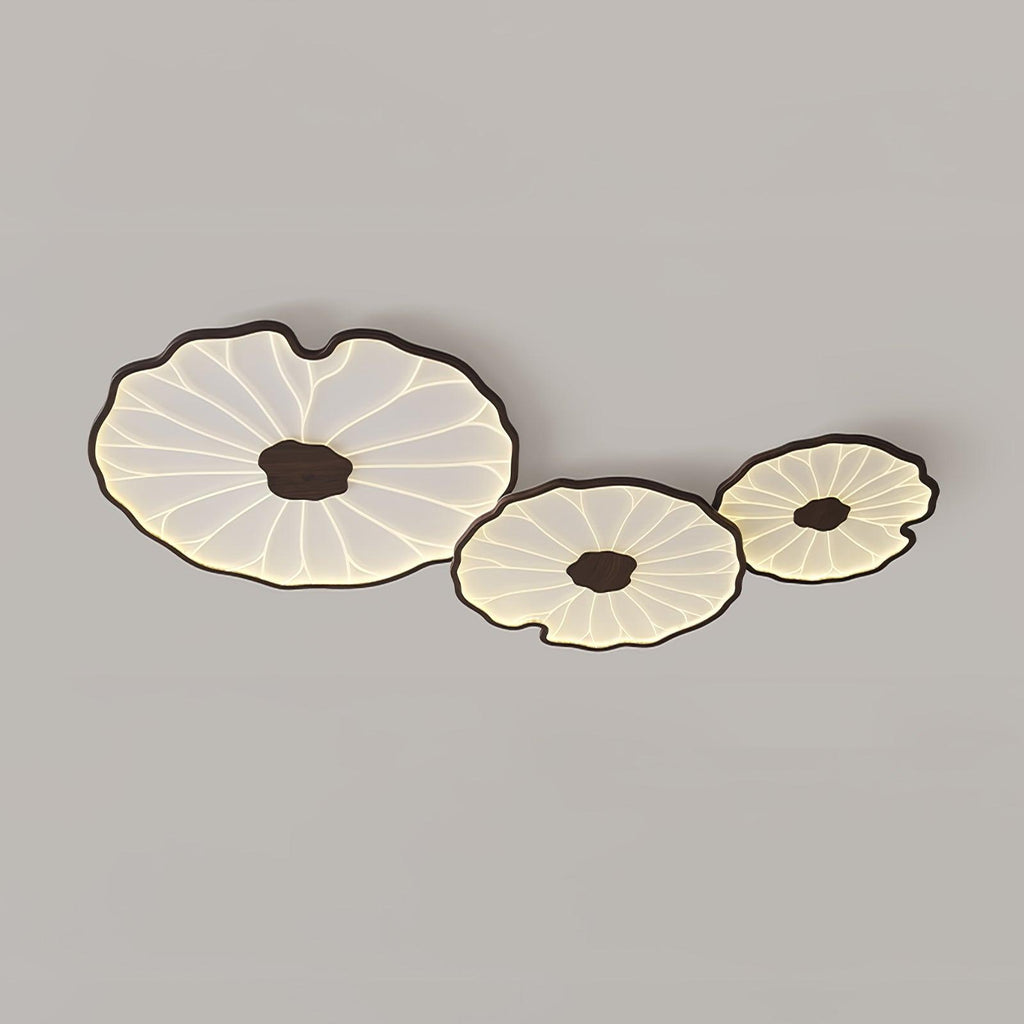 The Clérachic walnut-finish cluster of three shades, a wider crop leaving more grey ceiling in view.