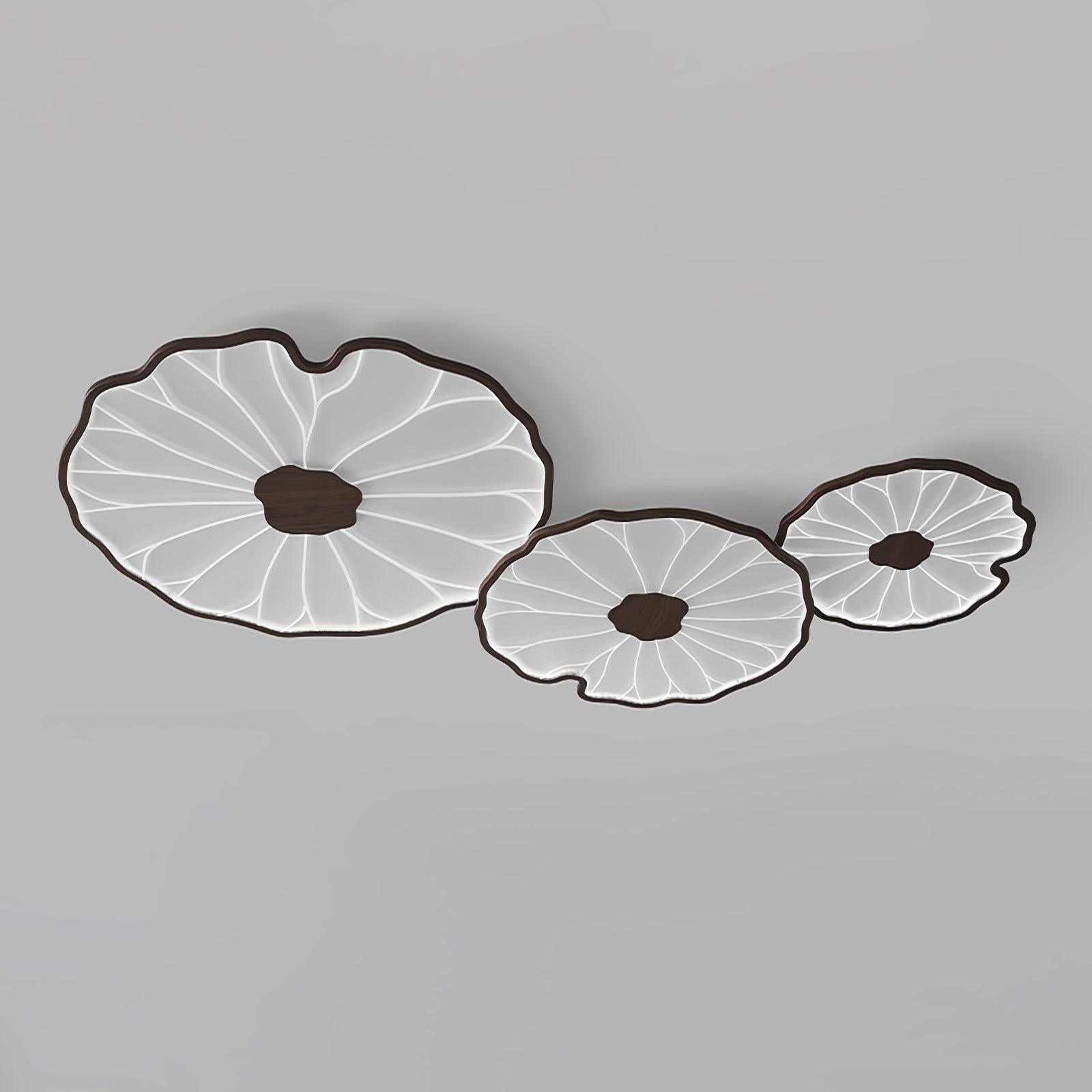 The Clérachic walnut-finish trio of shades lit in cool white light, framed close on a plain grey backdrop.