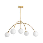 A gold Clérachic chandelier with five white glass globes on curved arms and a short gold rod, on a plain white backdrop.