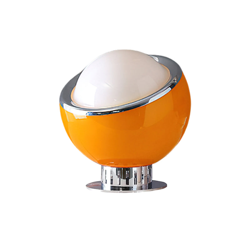 Amber-yellow version of this Clérachic table lamp, with a glossy body, white dome and chrome rim, tilted slightly toward the viewer.