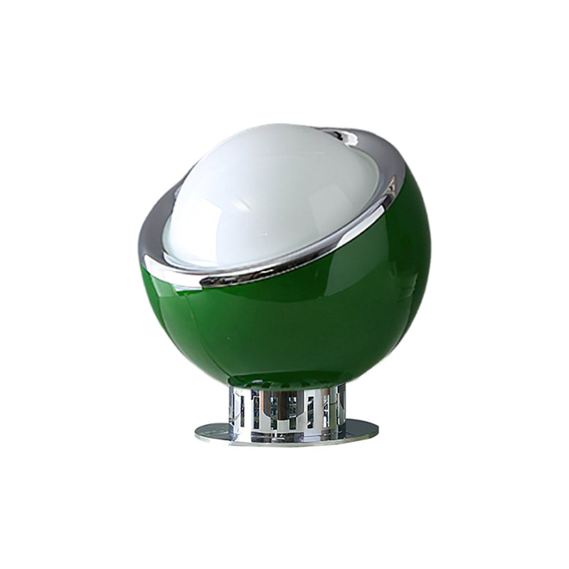 A dark-green glass body with a white dome and a chrome rim, on a ribbed chrome stand, shown for this Clérachic table lamp.