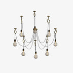 A near-identical front view of this Clérachic pendant, with eight bulbs and copper hook rings, lit more softly on a white backdrop.