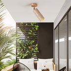 Clérachic travertine spotlight with a pale wood canopy on a white ceiling over a balcony seating area with green climbing plants.