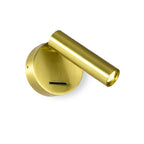 A Clérachic wall light in a bright gold-brass tone, its cylinder head turned out from a round backplate with a slim switch, on white.
