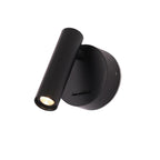 Three-quarter view of a black Clérachic spotlight wall light with a round backplate and its head angled down, on a white backdrop.