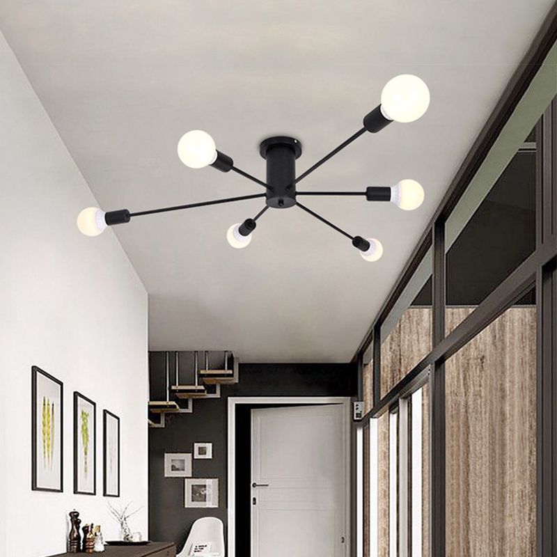 The black Clérachic Sputnik Globe Ceiling Light lights a narrow hallway ceiling above a doorway and framed wall art.