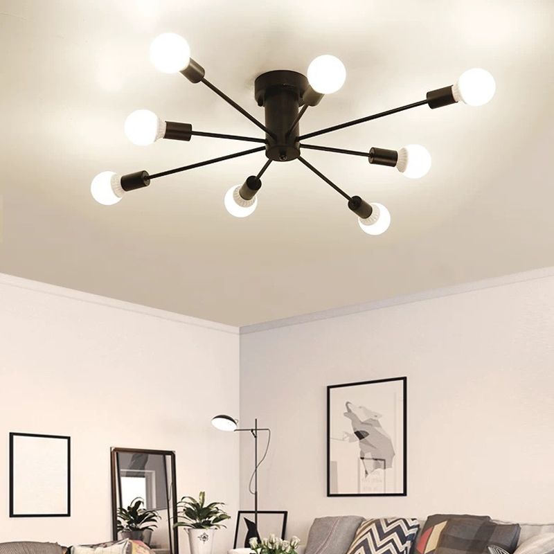 A black Clérachic Sputnik Globe Ceiling Light spans a living room ceiling above a sofa, floor lamp, and framed art.