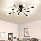 A black Clérachic Sputnik Globe Ceiling Light spans a living room ceiling above a sofa, floor lamp, and framed art.