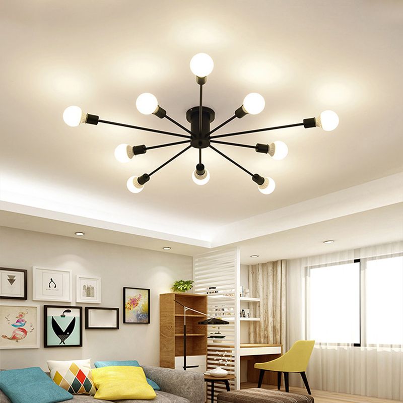 A black Clérachic Sputnik Globe Ceiling Light spans a living room ceiling near a bookshelf, armchair, and potted plants.