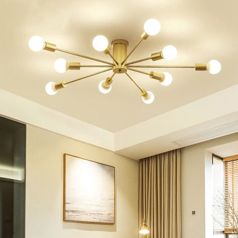 The gold Clérachic Sputnik Globe Ceiling Light warms a living room with sheer curtains and a small floor lamp.