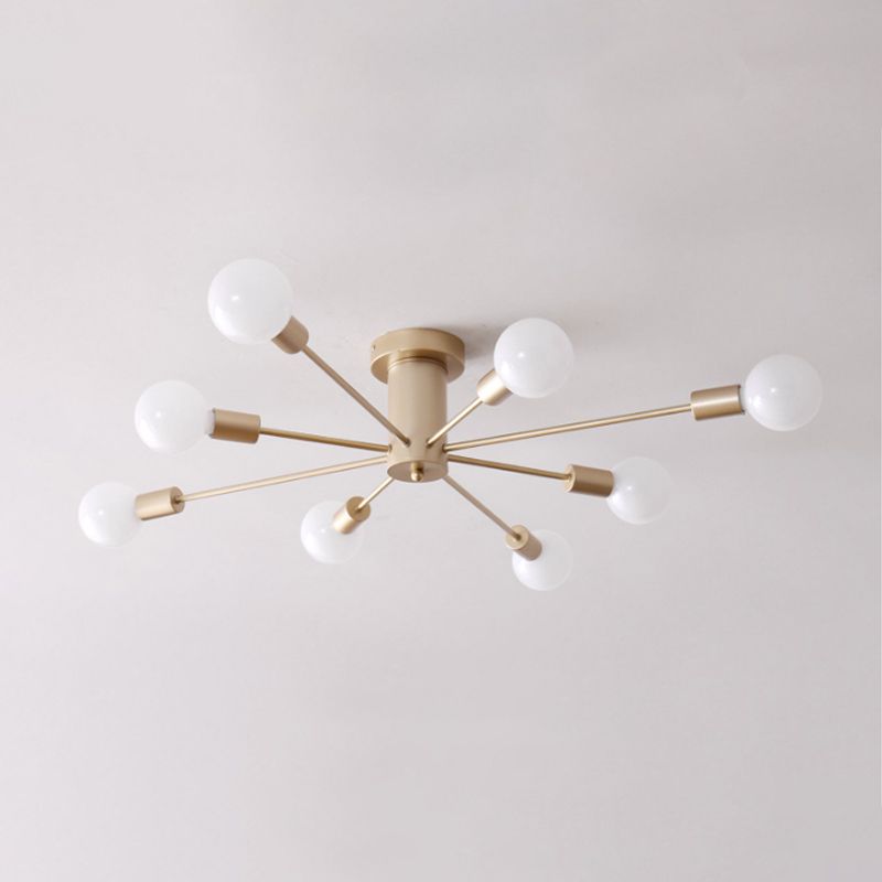 A close angled view of the gold Clérachic Sputnik Globe Ceiling Light mounted against a plain white ceiling.