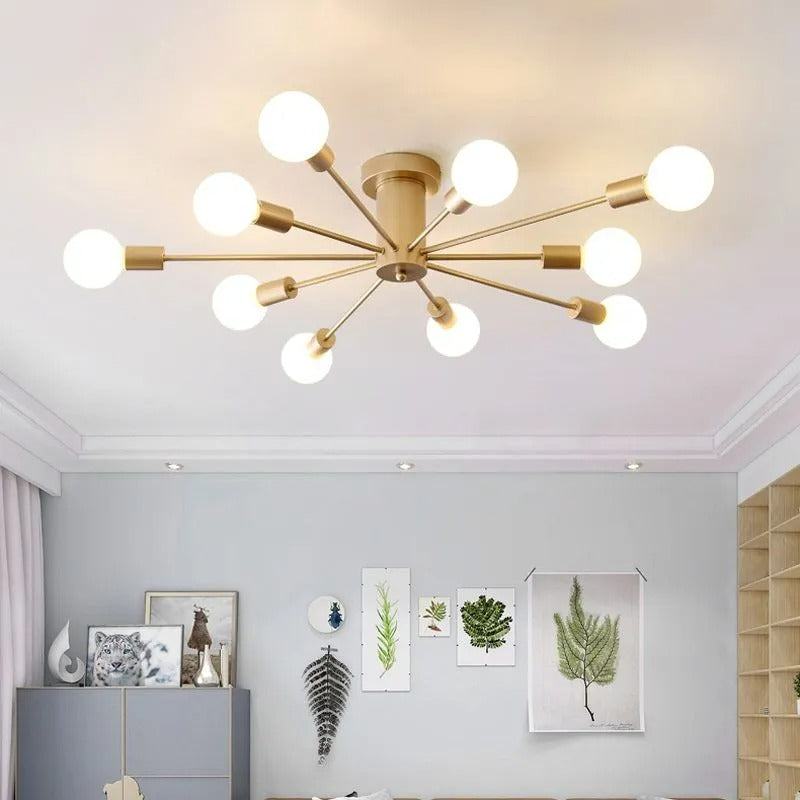 This gold Clérachic Sputnik Globe Ceiling Light lights a living room with a gallery wall, potted plants, and a cabinet.