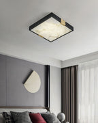 Clérachic Square Alabaster Flush Mount Ceiling Light glowing above a bed in a grey panelled bedroom, sitting close to the plaster with no visible drop.