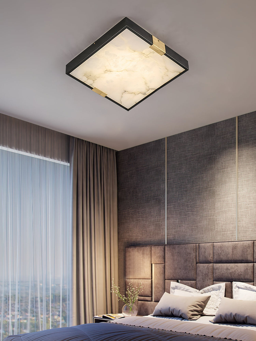 Clérachic Square Alabaster Flush Mount Ceiling Light lit above an upholstered headboard in a high-rise bedroom, the stone glowing warm at the ceiling.