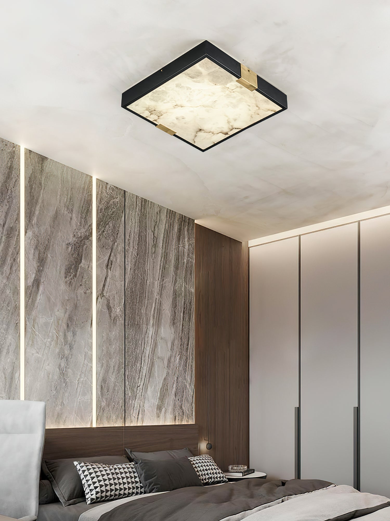 Clérachic Square Alabaster Flush Mount Ceiling Light lit beside built-in wardrobes, its brass corner saddles catching the light against the black frame.