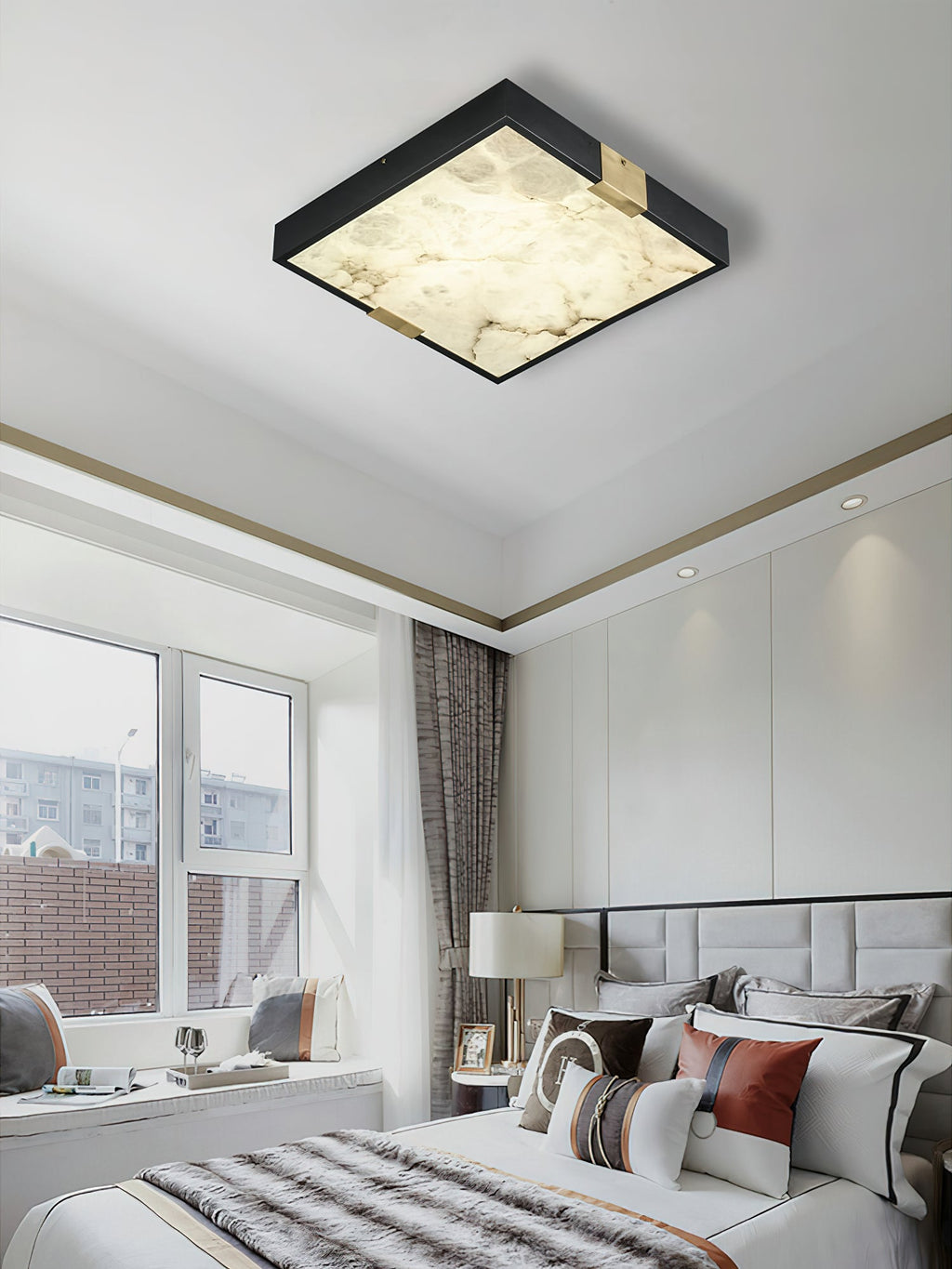 Clérachic Square Alabaster Flush Mount Ceiling Light lit in a bright white bedroom with a window seat, the alabaster warm against the pale ceiling.
