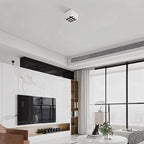 Clérachic white nine-cell square box downlight on the ceiling of a bright living room with a marble feature wall and tall windows.