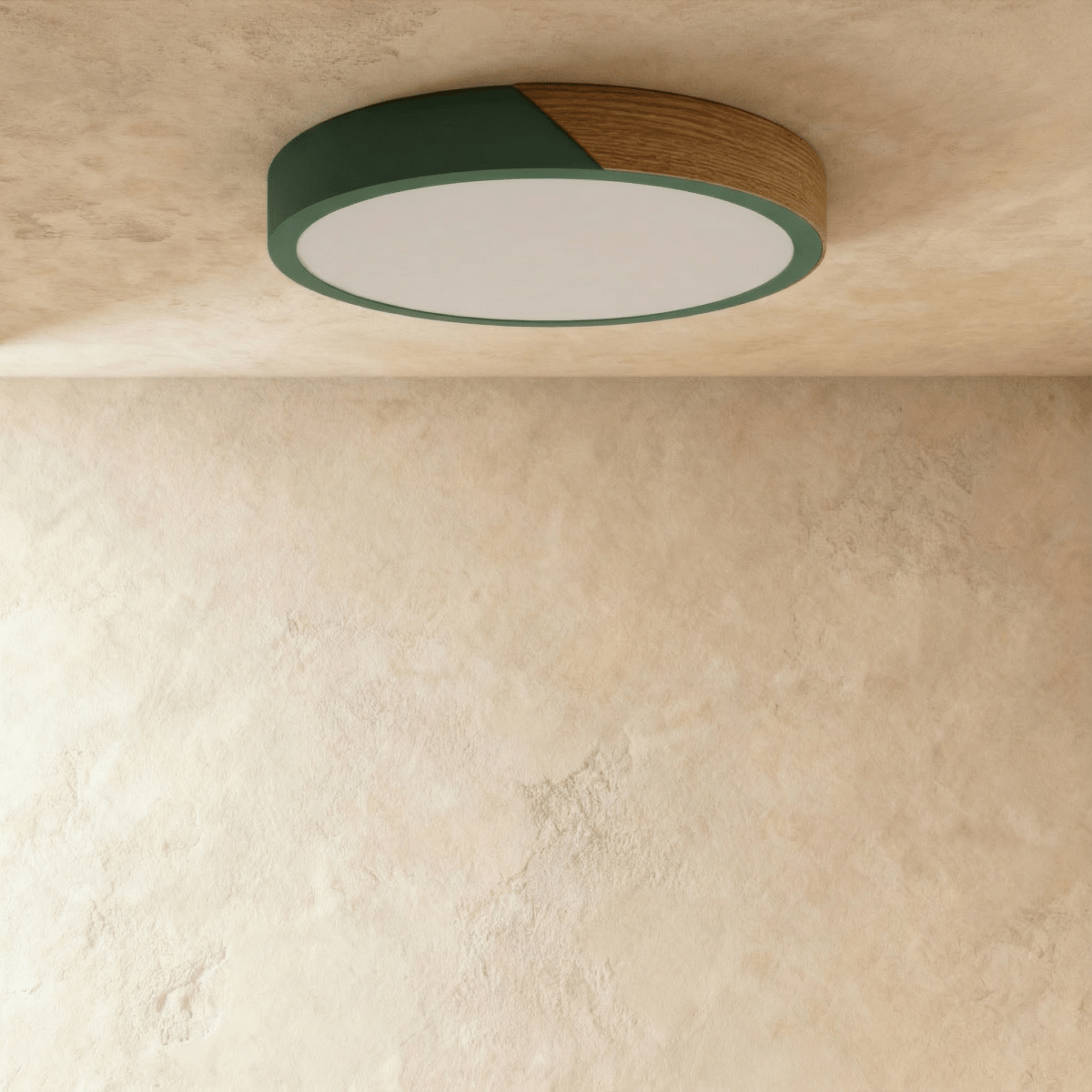 Clérachic round flush ceiling light in deep green and wood, unlit, showing the straight seam where the green band meets the wood section.