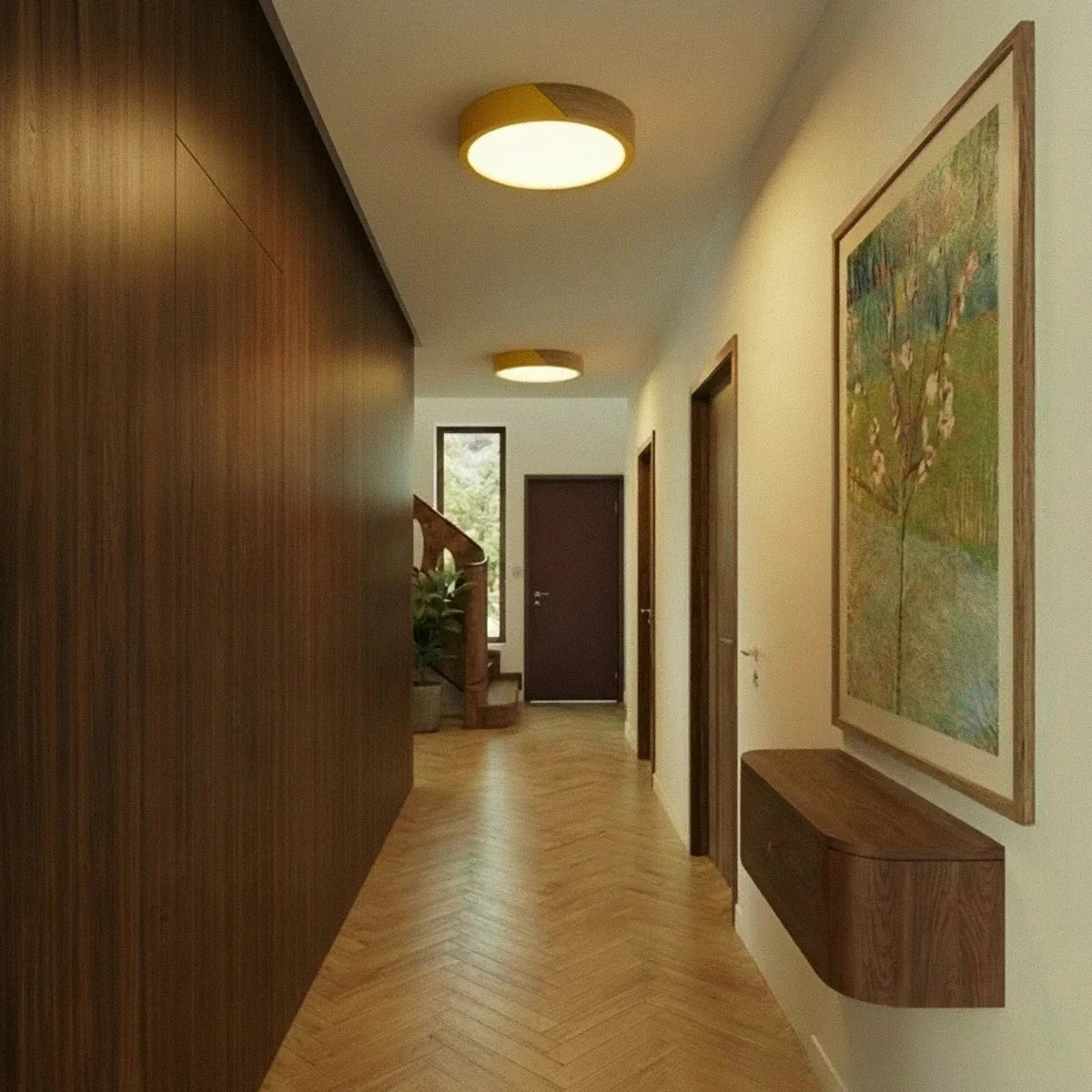 Clérachic round flush ceiling lights in golden yellow and wood, a pair of them lighting a wood-panelled hallway with a staircase beyond.