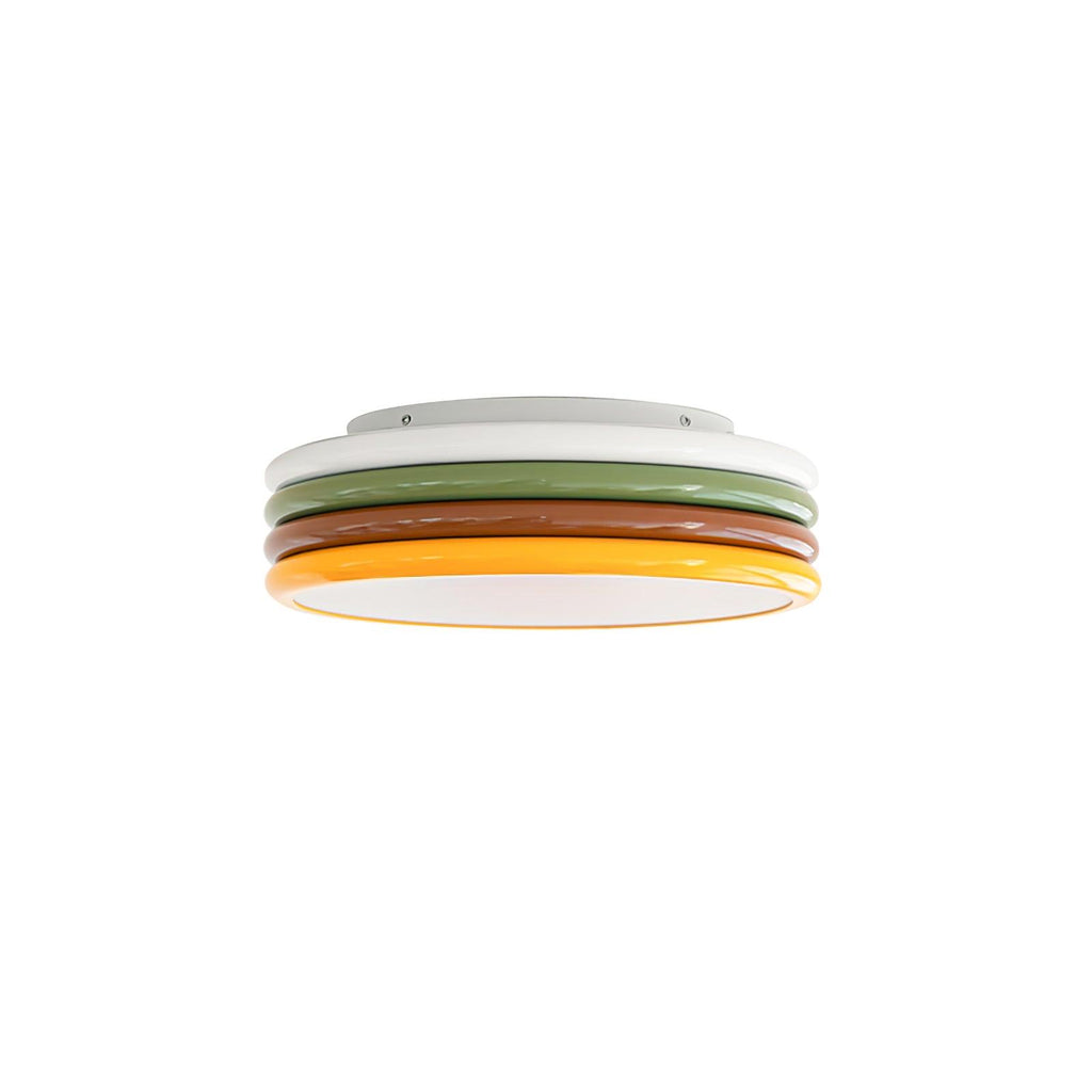 Small Clérachic stacked ceiling light with white, green, red-brown and yellow rings and a flat base, on a pure white background.