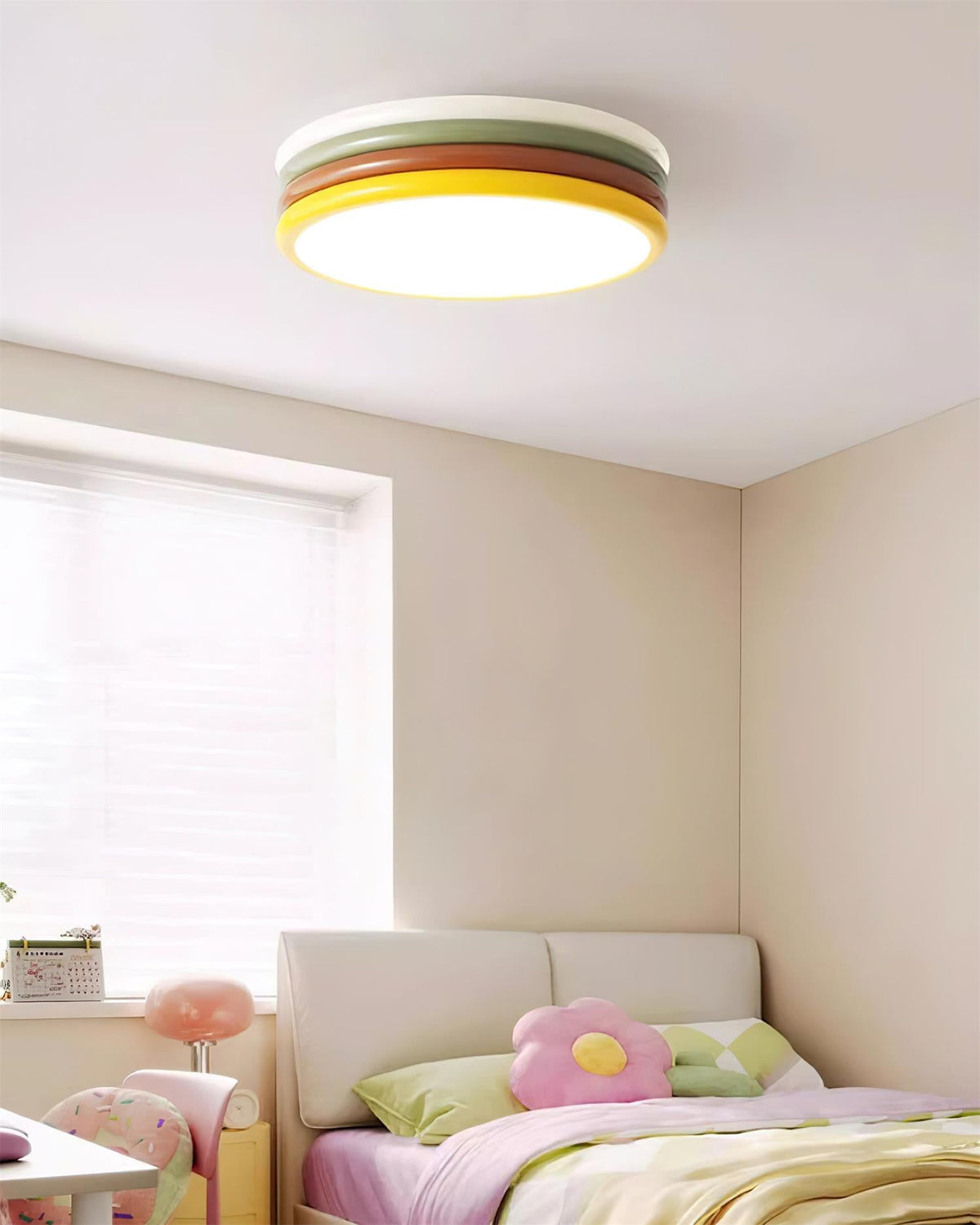 Clérachic stacked ceiling light above a pink and cream girl's room, with a flower cushion on the bed and a window with blinds.