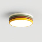 Clérachic stacked ceiling light with a cream top ring, lit on a light grey backdrop, seen from slightly below.