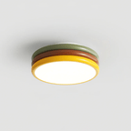 Compact view of this Clérachic ceiling light, three coloured tiers and a lit yellow-rimmed diffuser on a grey background.