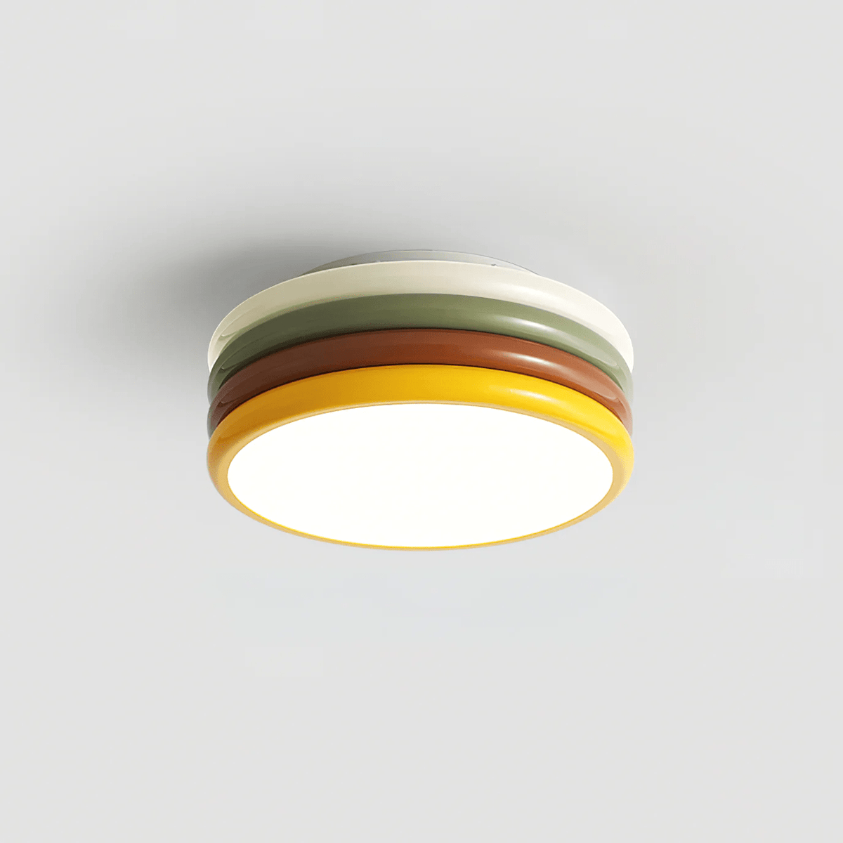 Clérachic stacked ceiling light with a white upper ring and a yellow rim, lit against a plain light backdrop.