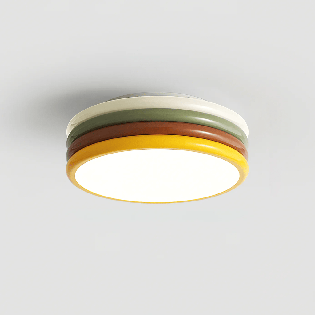 Clérachic ceiling light seen from below and to one side, its warm yellow rim and cream top ring around a softly lit diffuser.