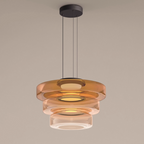 The Clérachic Stacked Glass Disc Pendant Light in its full three-tier amber build, each disc narrower and clearer as it drops.