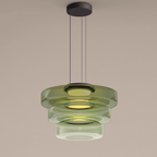 Three-tier green build of the Clérachic Stacked Glass Disc Pendant Light, lit, with the tint graduating paler down the stack.