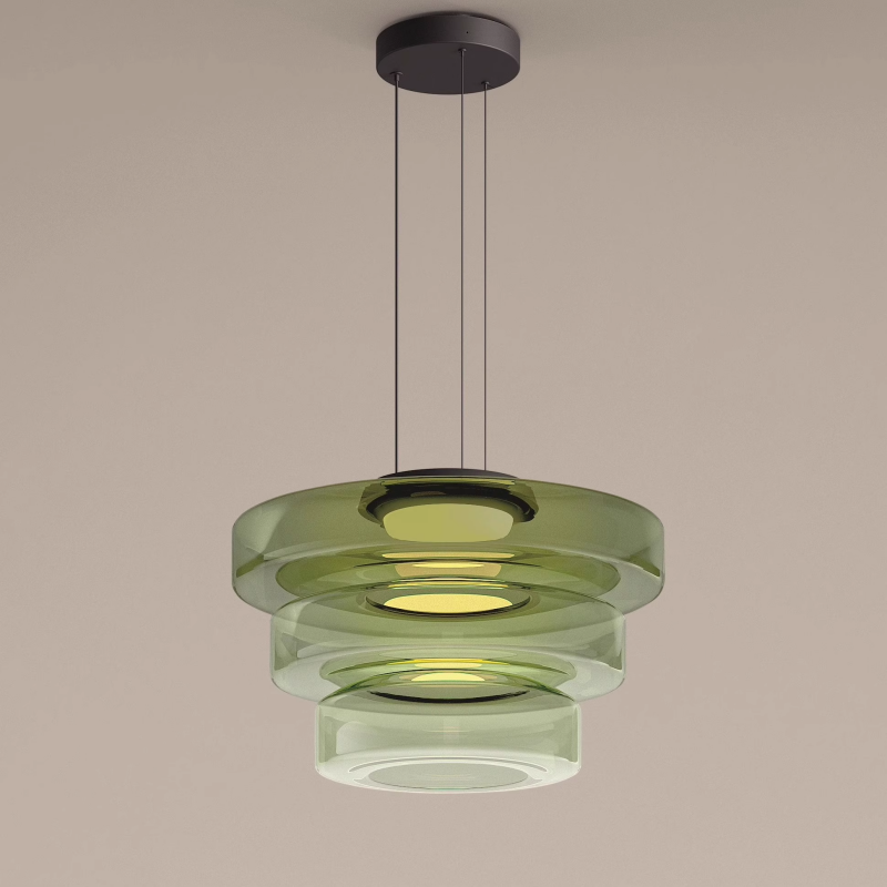 Three-tier green build of the Clérachic Stacked Glass Disc Pendant Light, lit, with the tint graduating paler down the stack.