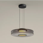 Clérachic Stacked Glass Disc Pendant Light in Smoke Gray, one tier with a honey-warm diffuser pooling light at its centre.