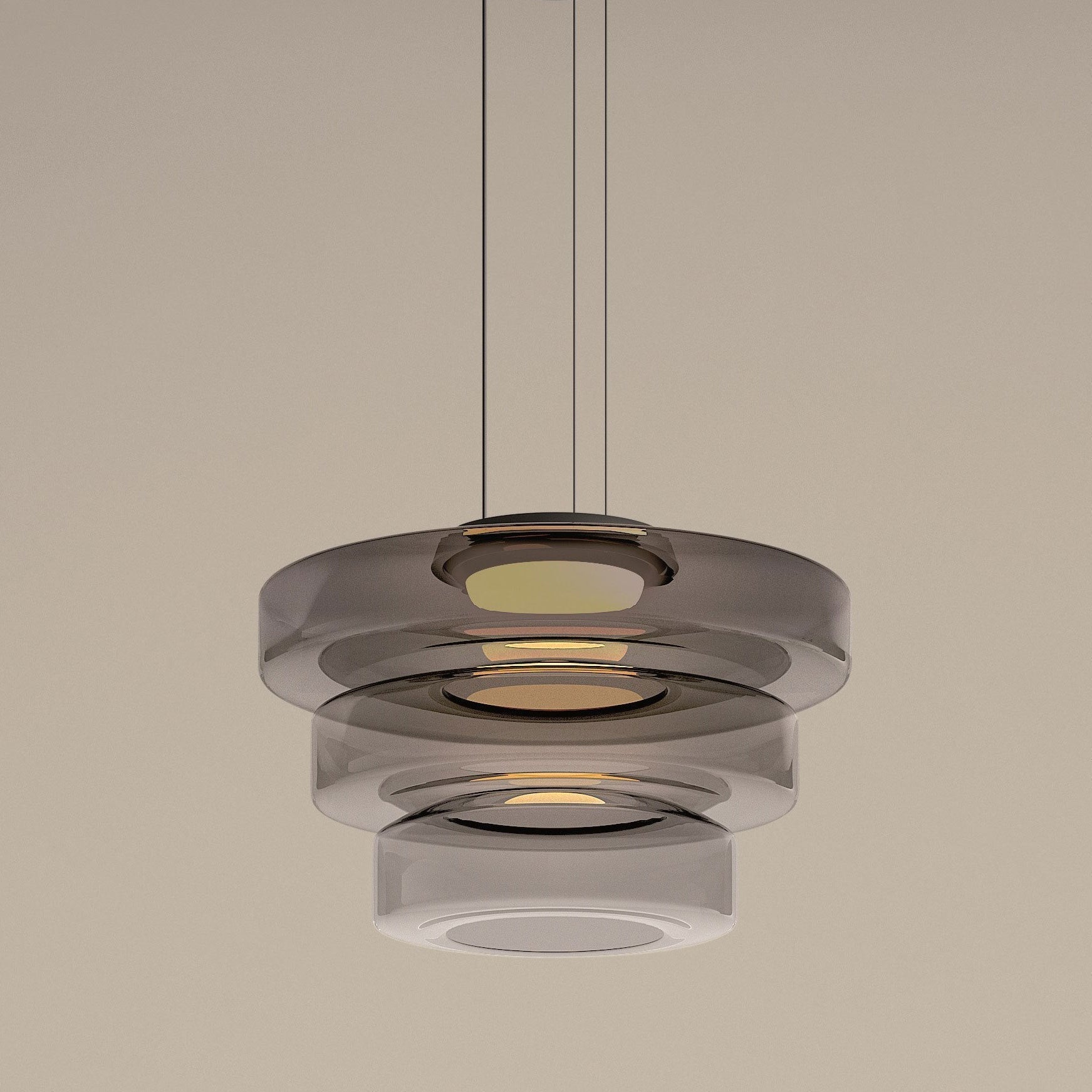 Close view of the three-tier Smoke Gray Clérachic Stacked Glass Disc Pendant Light, a rolled bead catching light on every rim.