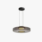 Clérachic Stacked Glass Disc Pendant Light shown on white with its full three-cable drop from the round black ceiling canopy.