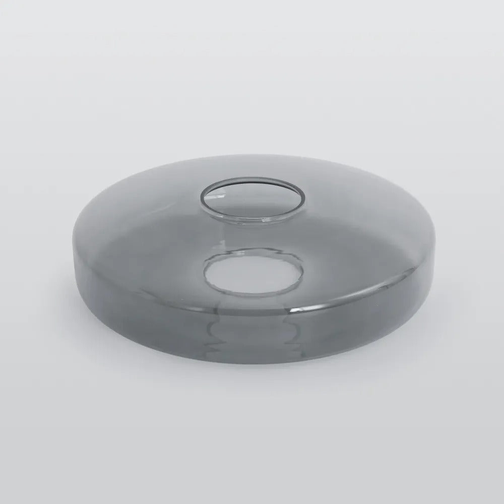 Smoke Gray glass tier for the Clérachic Stacked Glass Disc Pendant Light, lying on white with the fitting hole uppermost.