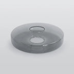 Smoke Gray glass tier for the Clérachic Stacked Glass Disc Pendant Light, lying on white with the fitting hole uppermost.