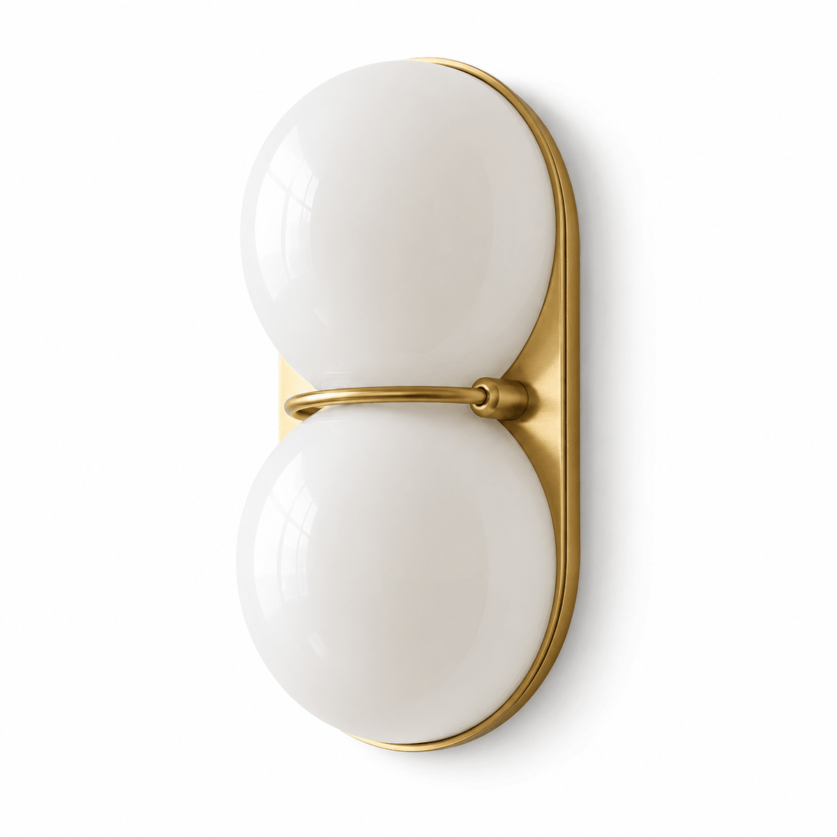 A pair of opaque white glass globes stacked on a gold-toned oval plate, shown front-on as a Clérachic wall light on white.