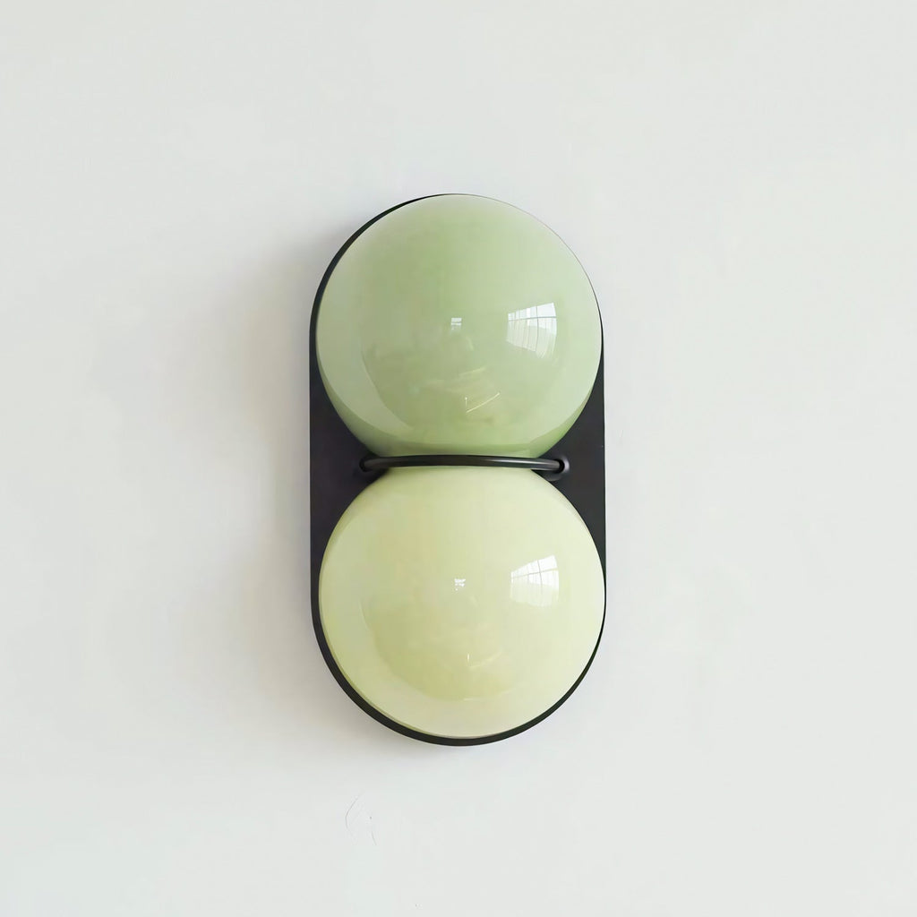 Black-backed Clérachic sconce in pale sage over a soft lime tone, photographed straight on against a mint-white wall.