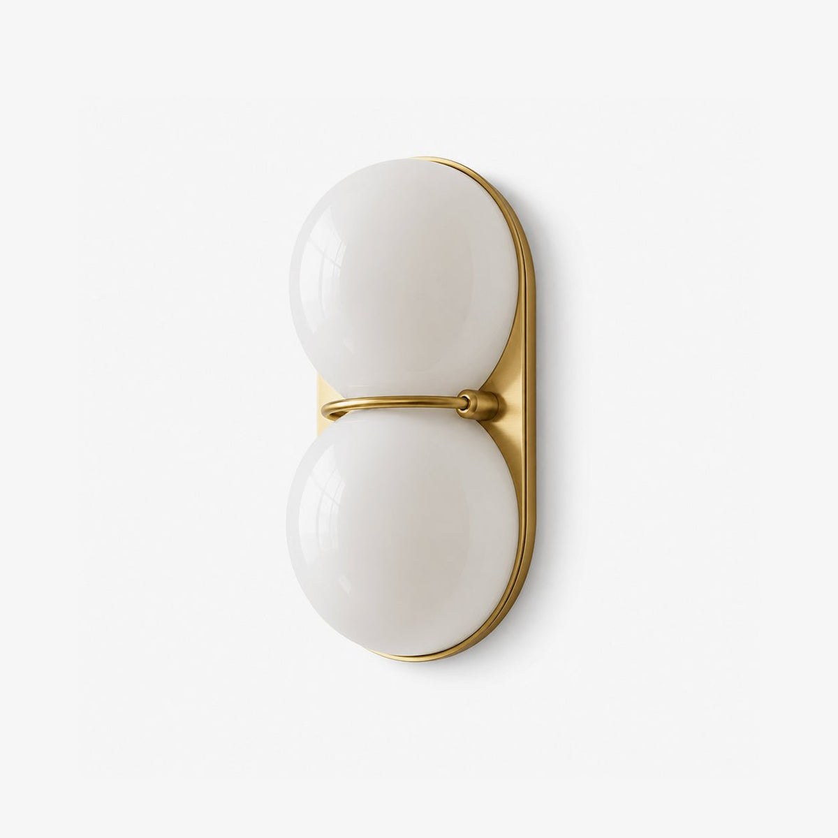 Brass-coloured plate and a slim bar between two white globes, this Clérachic wall light is photographed on a clean white ground.