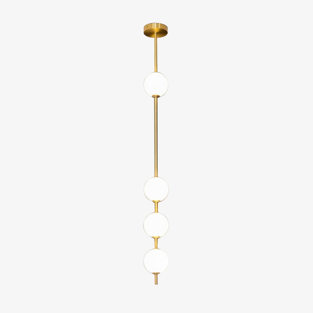 This Clérachic pendant on a plain white backdrop, with four opal white globes spaced along a slim brass column from a round brass ceiling plate.