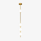 This Clérachic pendant on a plain white backdrop, with four opal white globes spaced along a slim brass column from a round brass ceiling plate.
