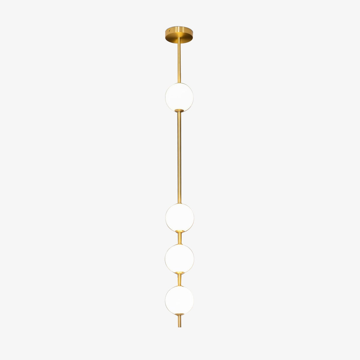 This Clérachic pendant on a plain white backdrop, with four opal white globes spaced along a slim brass column from a round brass ceiling plate.