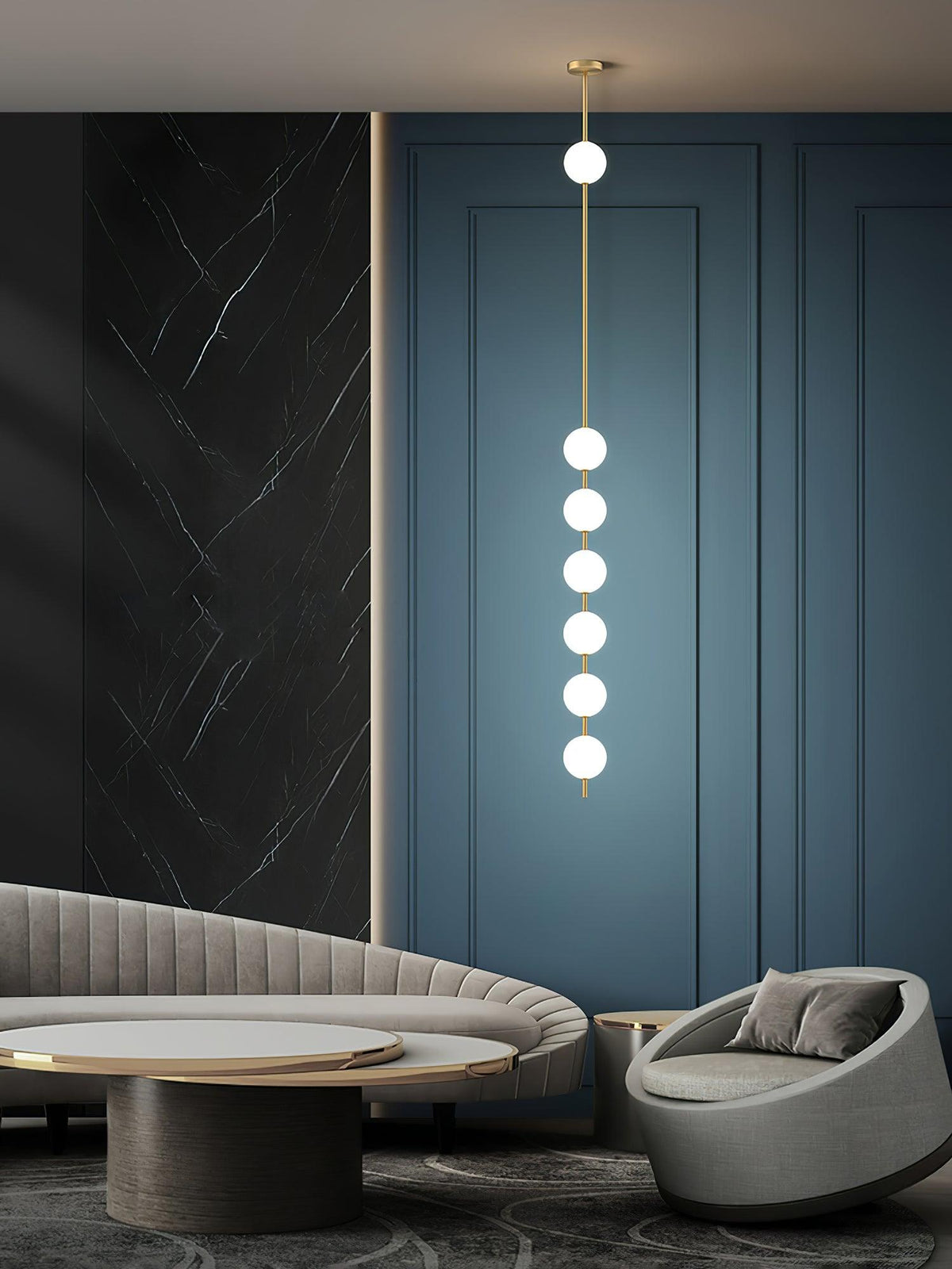 Six-globe Clérachic pendant in a lounge with a blue panelled wall, a dark marble panel and a curved grey sofa.