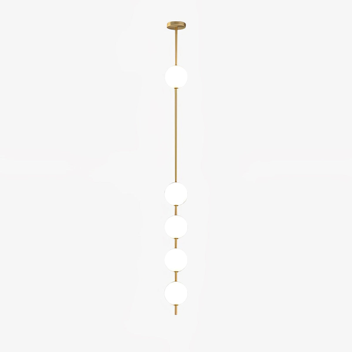 Five-globe Clérachic pendant on a white backdrop, with its slim brass column and round ceiling plate, and one globe set high on the rod.