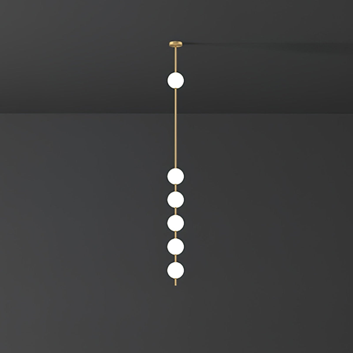Clérachic pendant with five opal globes lit white on a brass column, against a dark charcoal wall and ceiling.