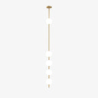 Five opal globes on a thin brass column from a Clérachic pendant, shown on a plain white backdrop with a small brass ceiling plate.