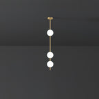 Three bright opal globes spaced along a brass rod, a short Clérachic pendant against a dark grey wall and ceiling.